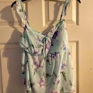 Mint colored Candie’s tank top with floral print.  Runs small